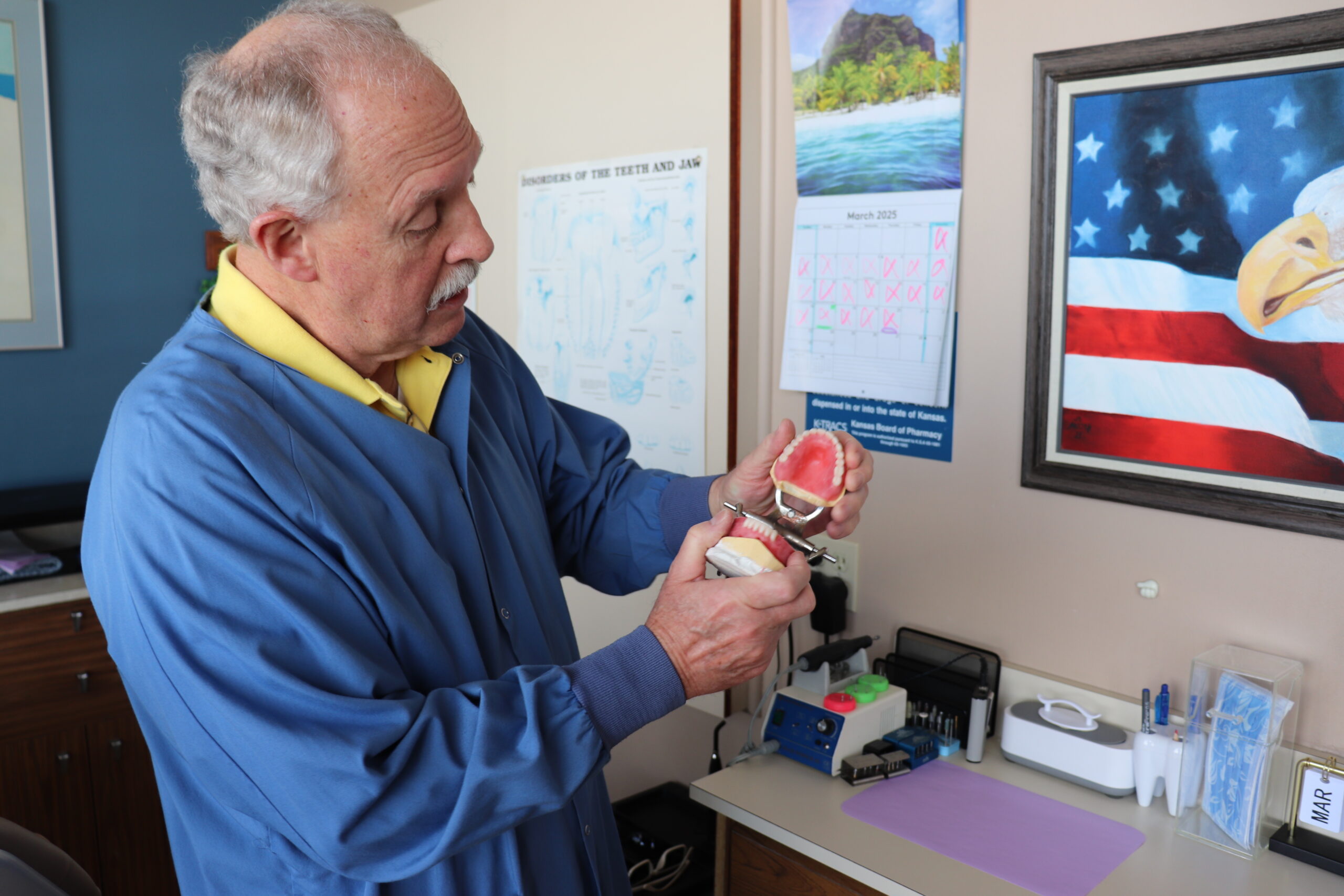 Dr. Hartman showing some dentures and how they articulate in his dental office