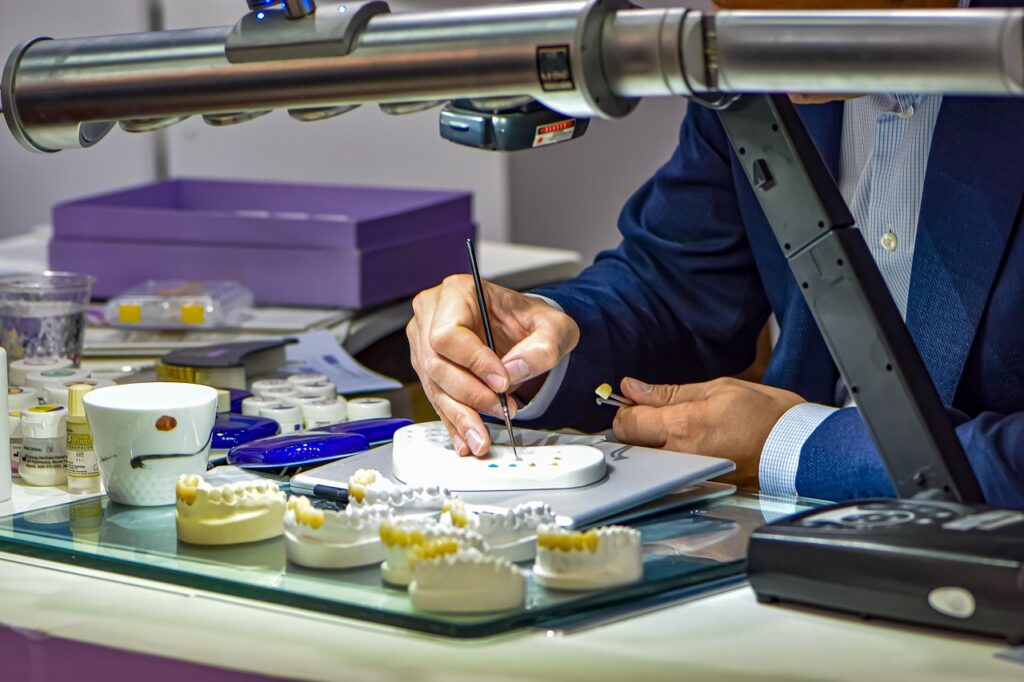 Dr Hartman working on dentures in the lab inside the dental practice in Bonner Springs, KS
