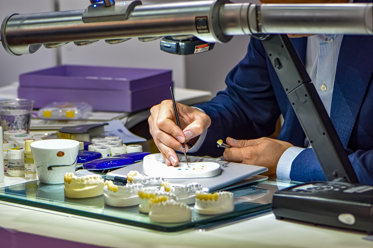 Dr Hartman working on dentures in the lab inside the dental practice in Bonner Springs, KS